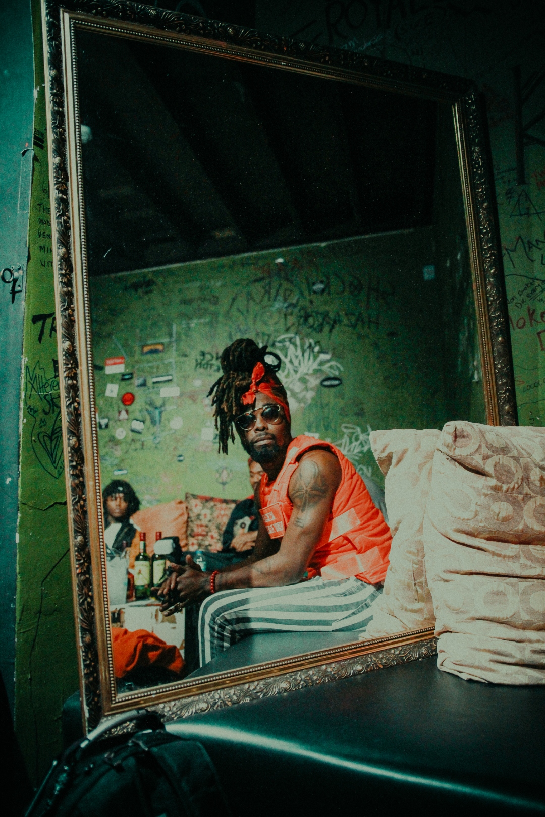 JID mirror portrait in green room