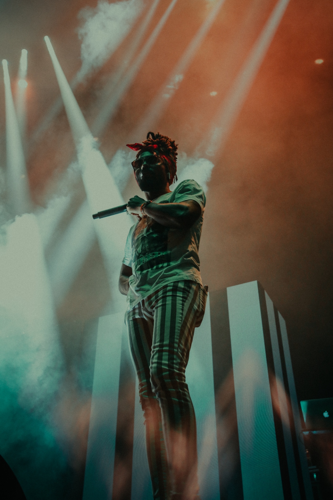 EarthGang under red spotlight in checker pants