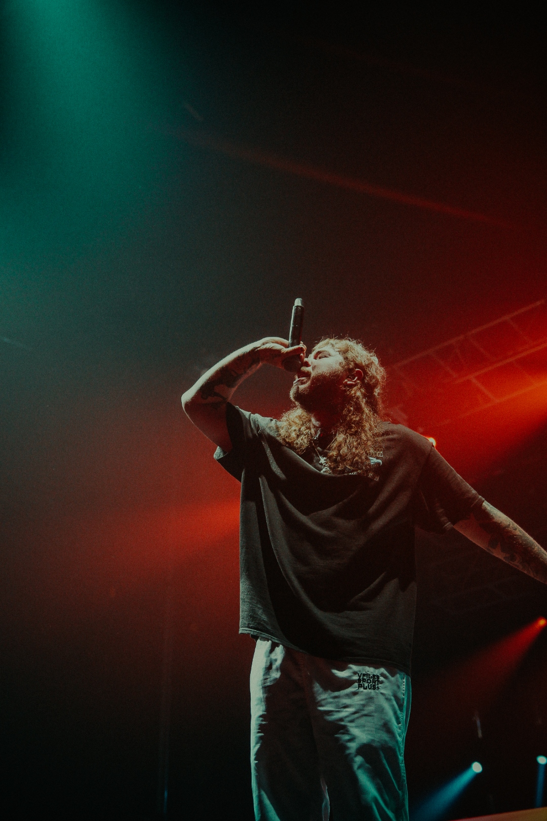 Mod Sun with mic held overhead