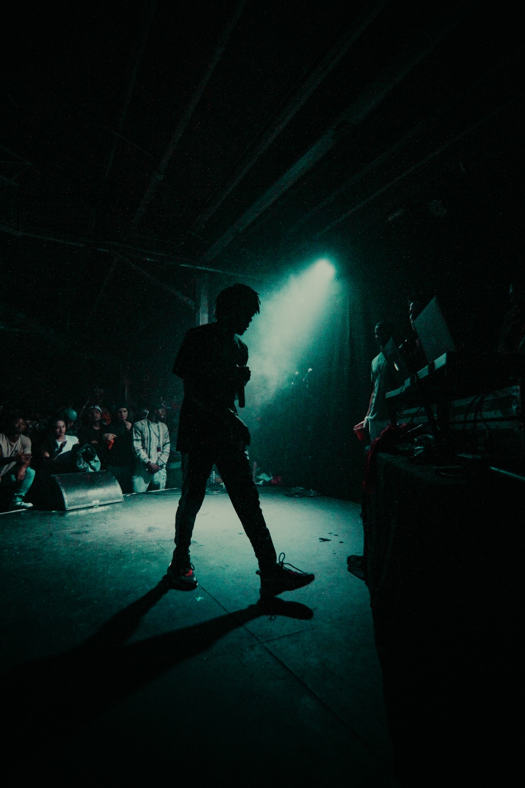 JID silhouette in stage haze